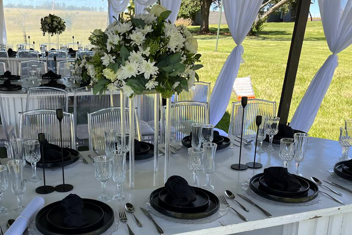 Elegant function tables set in a garden marquee