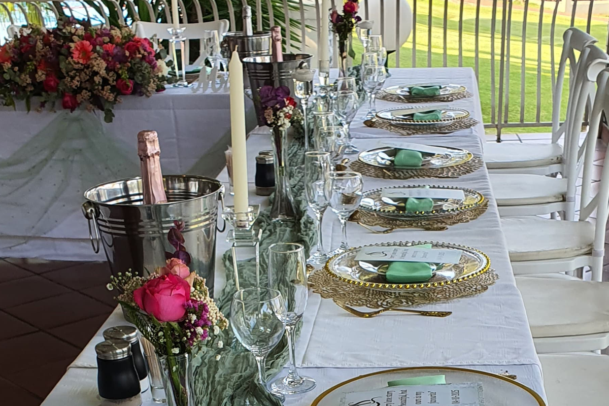 Celebration table set with flowers and sparkling wine