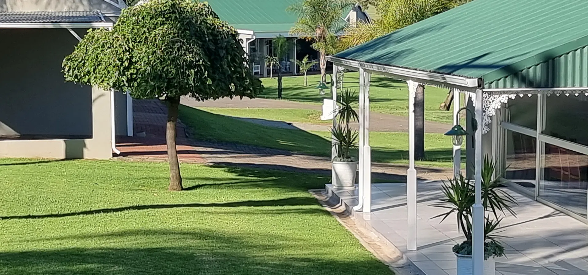 Covered veranda and lawns outside the conference centre