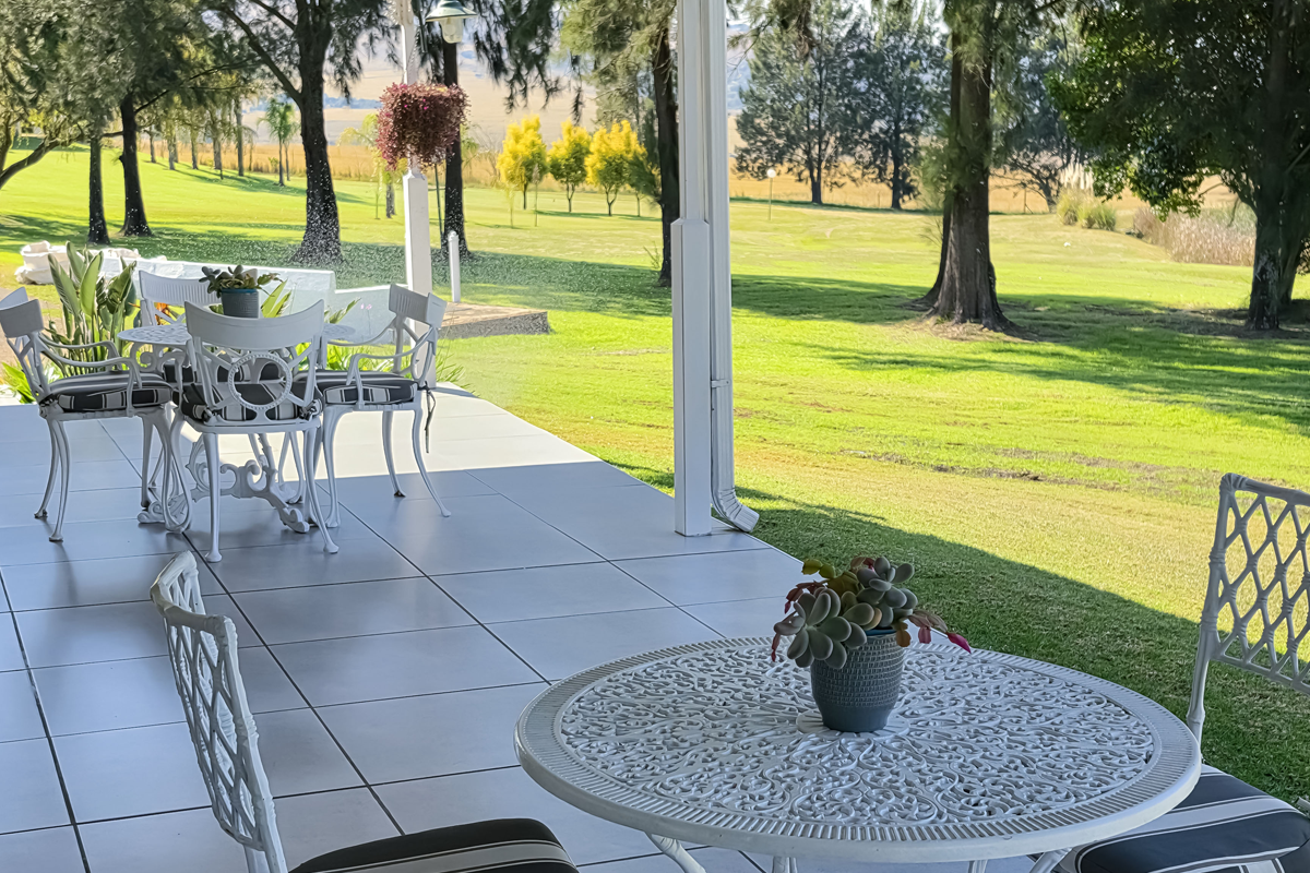 Veranda seating looking over the gardens and countryside
