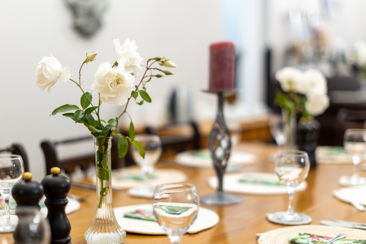 Dining table set with roses and candles